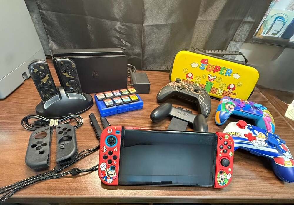 Nintendo Switch Console with Mario Skin and Accessories Bundle.